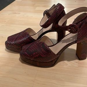 Kate Spade , snake print in burgundy red with black .
